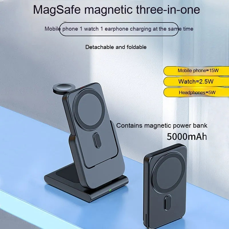 Black three-in-one magnetic power bank with folding stand charging iPhone 12, Apple Watch, and AirPods Pro wirelessly on a desk