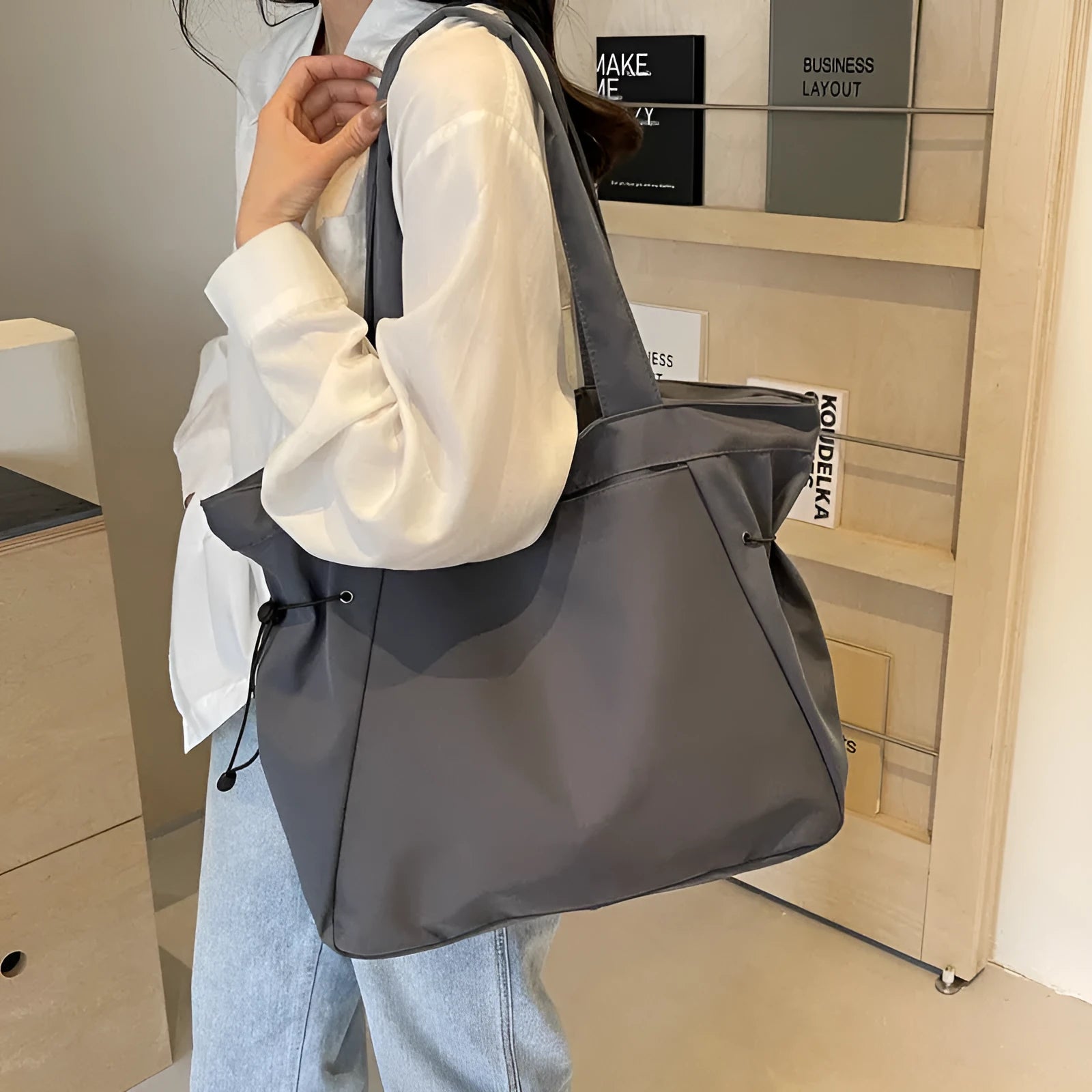 Soft foldable Oxford cloth commuter shoulder tote bag shown in light grey colour.