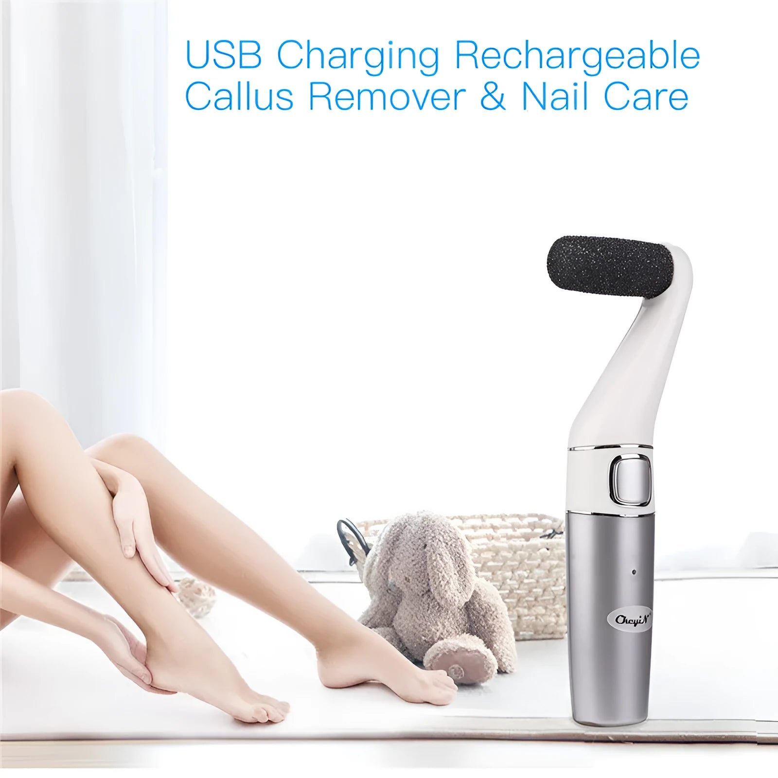 USB rechargeable electric foot file with three replacement rollers for callus and nail care, silver white ABS body on a clean surface
