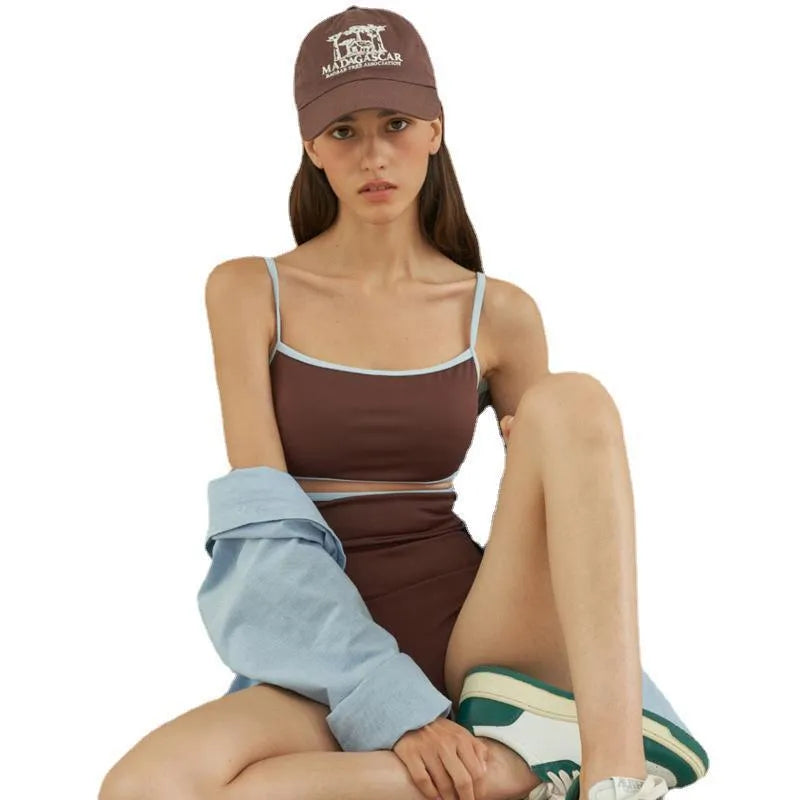 Brown nylon triangle one-piece swimsuit for women on a hanger