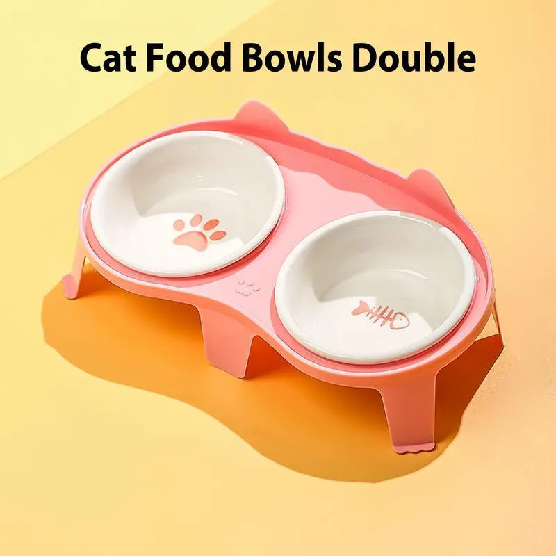 Blue ceramic cat food and water bowls on a white elevated plastic stand with a hook