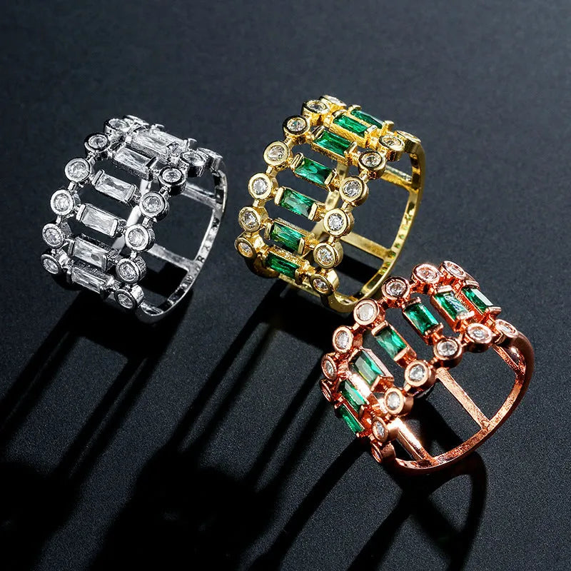 Gold-plated copper ring with hollow geometric setting and inlaid zircon stones