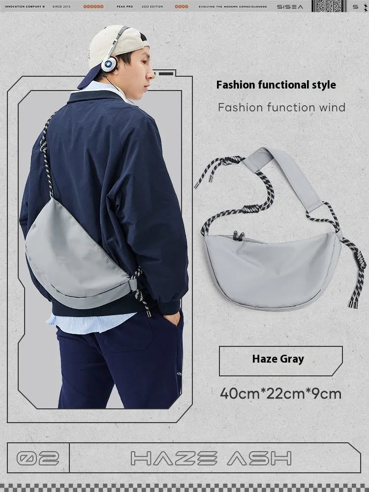 Men's lightweight nylon messenger bag in solid colour with large main compartment for daily use