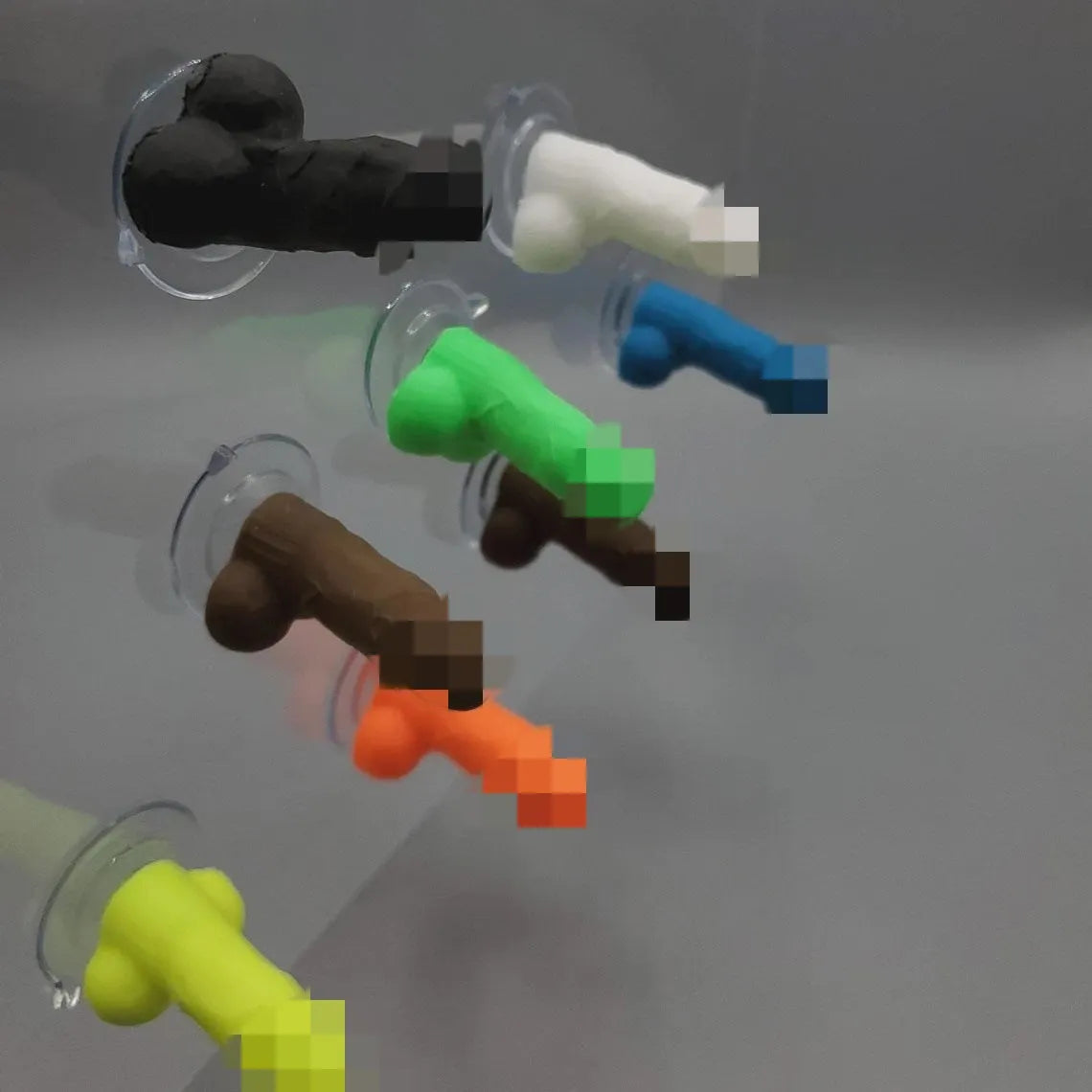 Five rubber tubeless valve caps in pink black green blue orange with modern art style