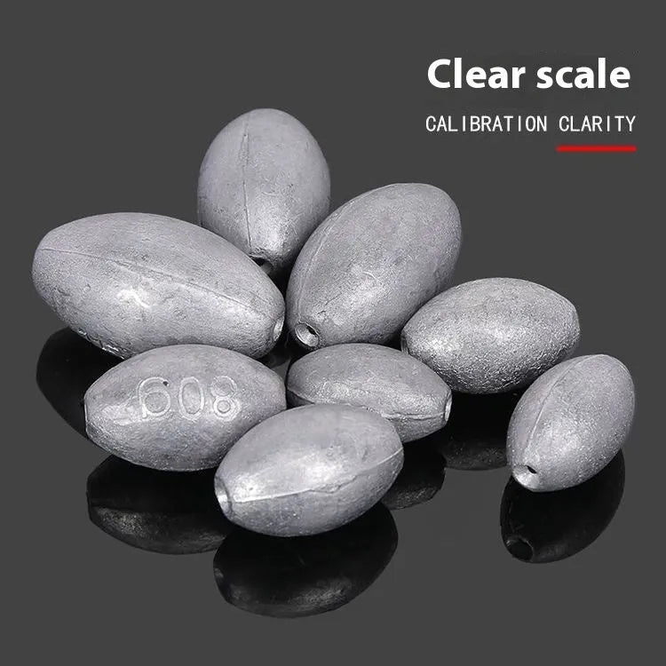 Olive lead fishing sinker with scale pattern showing rugby shape and plastic core construction