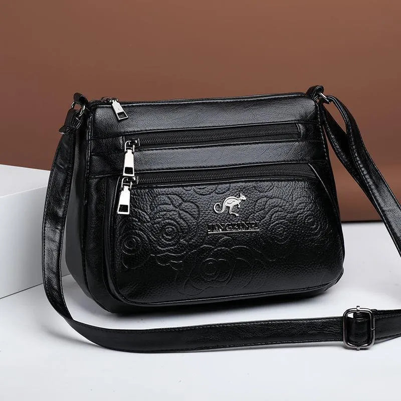 Black PU women's shoulder messenger bag with horizontal square shape, single strap, slit pocket, and phone bag