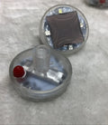 Colourful solar-powered LED hub decorative light flash for a car wheel with control switch.