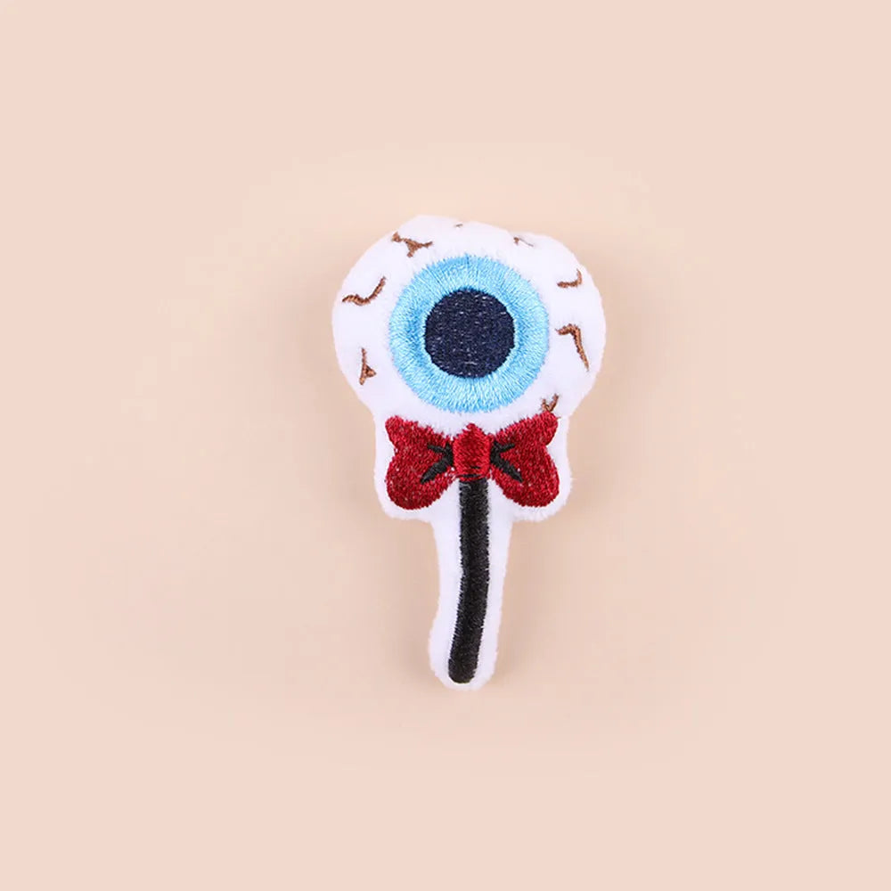 Small plush cat teaser wand toy with colourful candy or eyes design for interactive pet play.