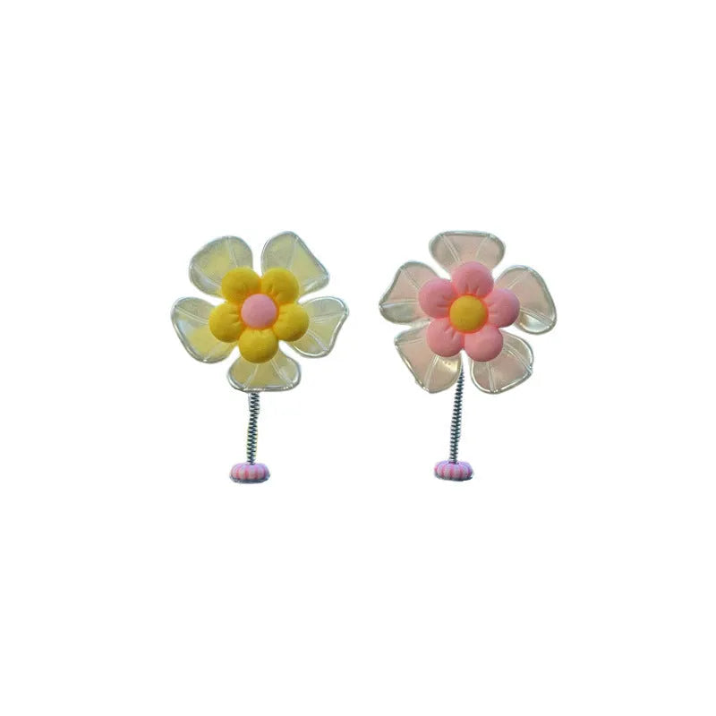 Coloured plastic car decoration swing ornament measuring approximately 5cm by 3.5cm