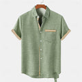 Loose-fit linen short-sleeved top with an ocean fish pattern embroidered on the lapel