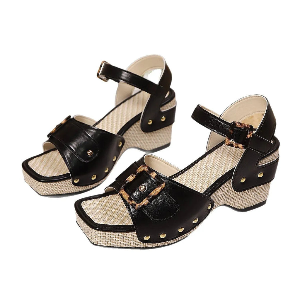 Women's black sandals with metal buckle fastening and chunky rubber sole, square toe design
