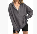 Women's loose raglan sleeve solid colour sweater in peacock green, showing casual pullover style