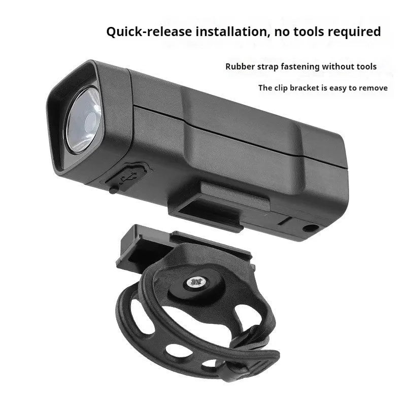 USB rechargeable bicycle headlight with quick-release strap on a handlebar.
