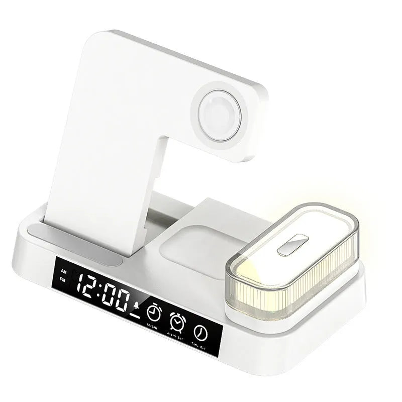 White 4-in-1 wireless charging station with foldable design showing phone charging, alarm clock display, and RGB night light
