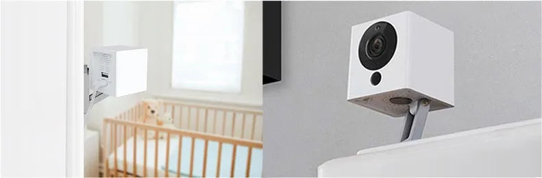 White compact indoor night vision security camera with 1080P resolution and 110° wide-angle lens on a shelf