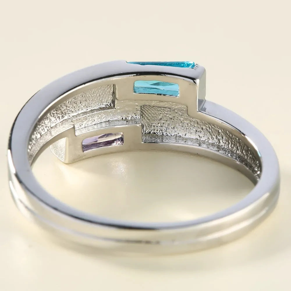 Silver electroplated copper ring with zircon stones, unisex European and American style fashion accessory.