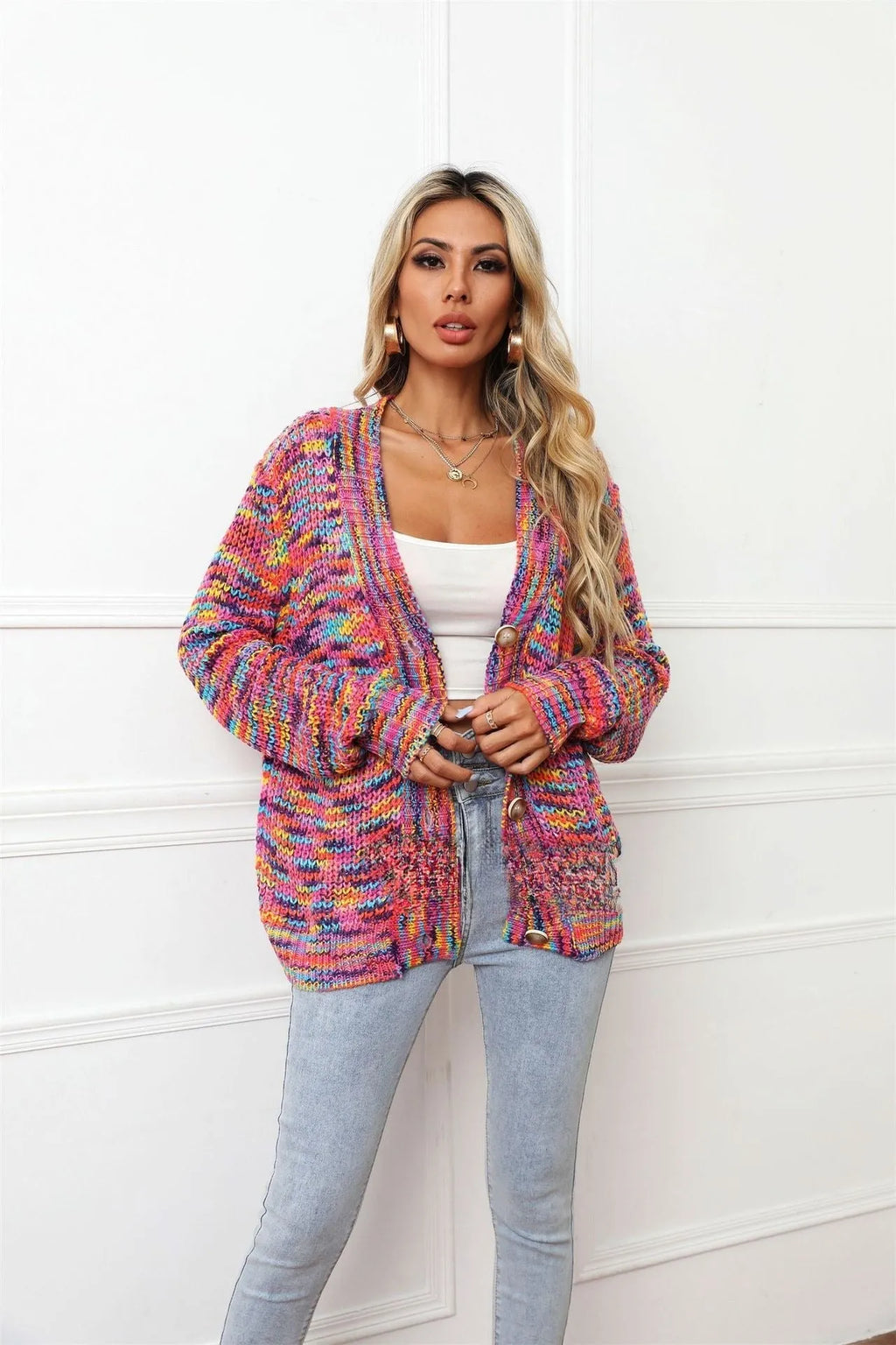 Rose Red rainbow striped loose-fit knitted cardigan coat on a hanger.