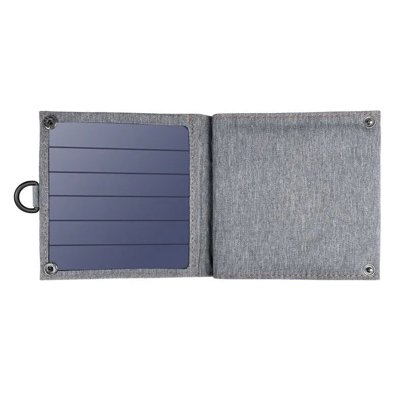 Grey foldable solar charger with USB port for mobile phone and tablet charging outdoors