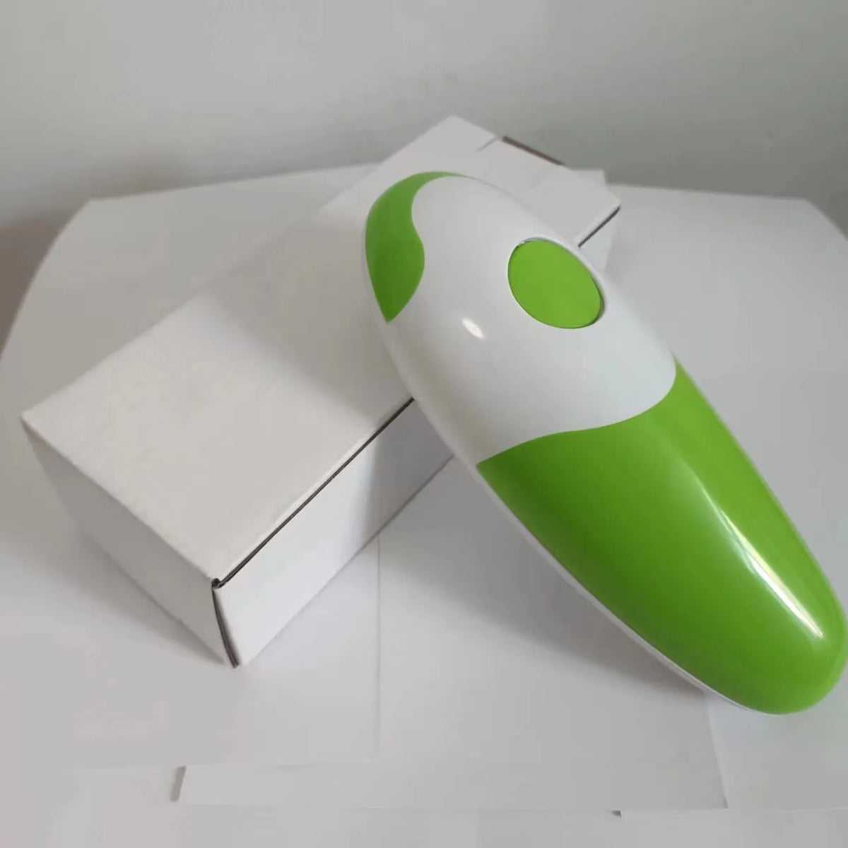 Electric can opener in plastic body, 16 x 6.5 x 4.8cm, shown in light green, purplish red, sky blue and red