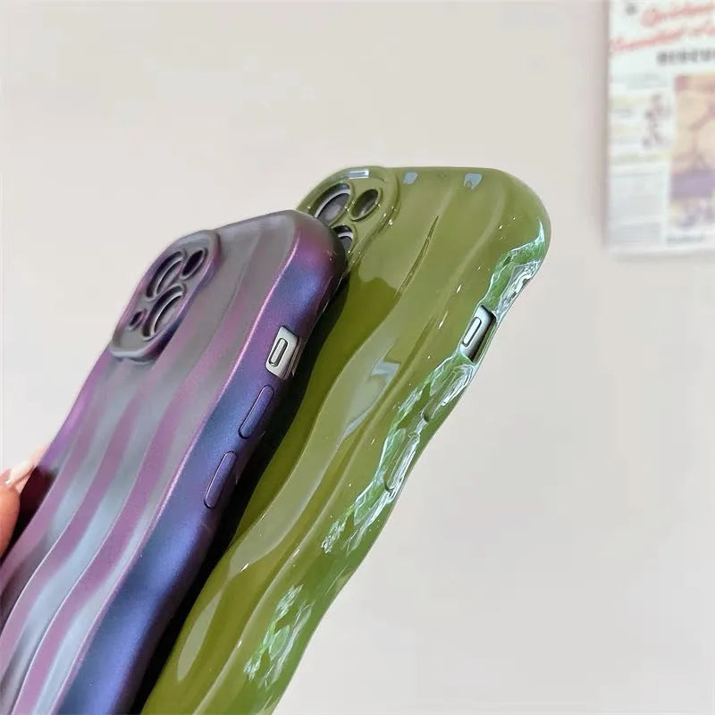Silicone iPhone case with water ripple texture in green, shown on an iPhone 17 Pro Max.
