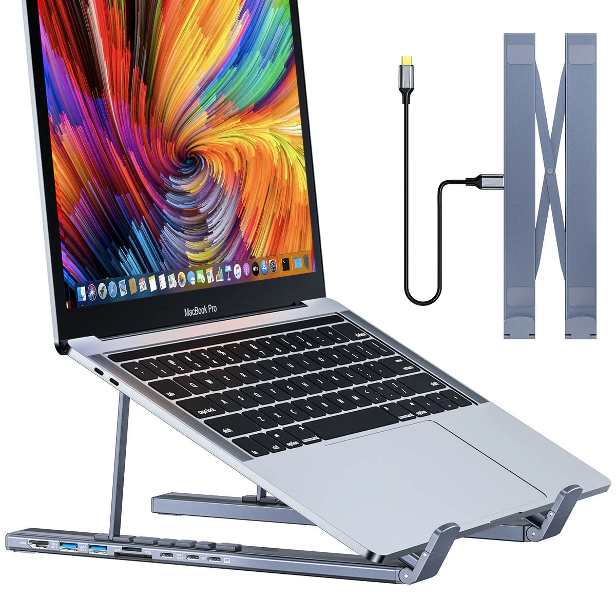 Aluminium folding laptop stand with built-in multi-port docking hub on a desk.