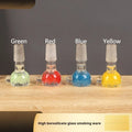 Coloured transparent glass tobacco pipe with geometric trumpet shape measuring 7cm