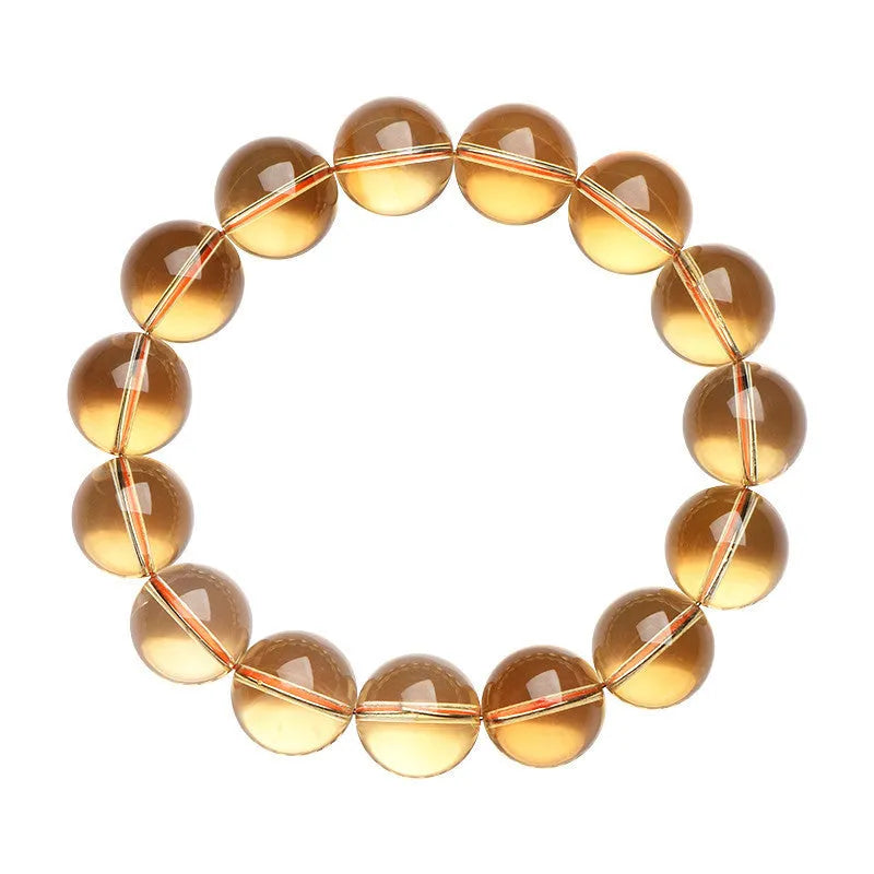 Natural citrine scattered beads ball bracelet showing polished stones and original design on wrist.