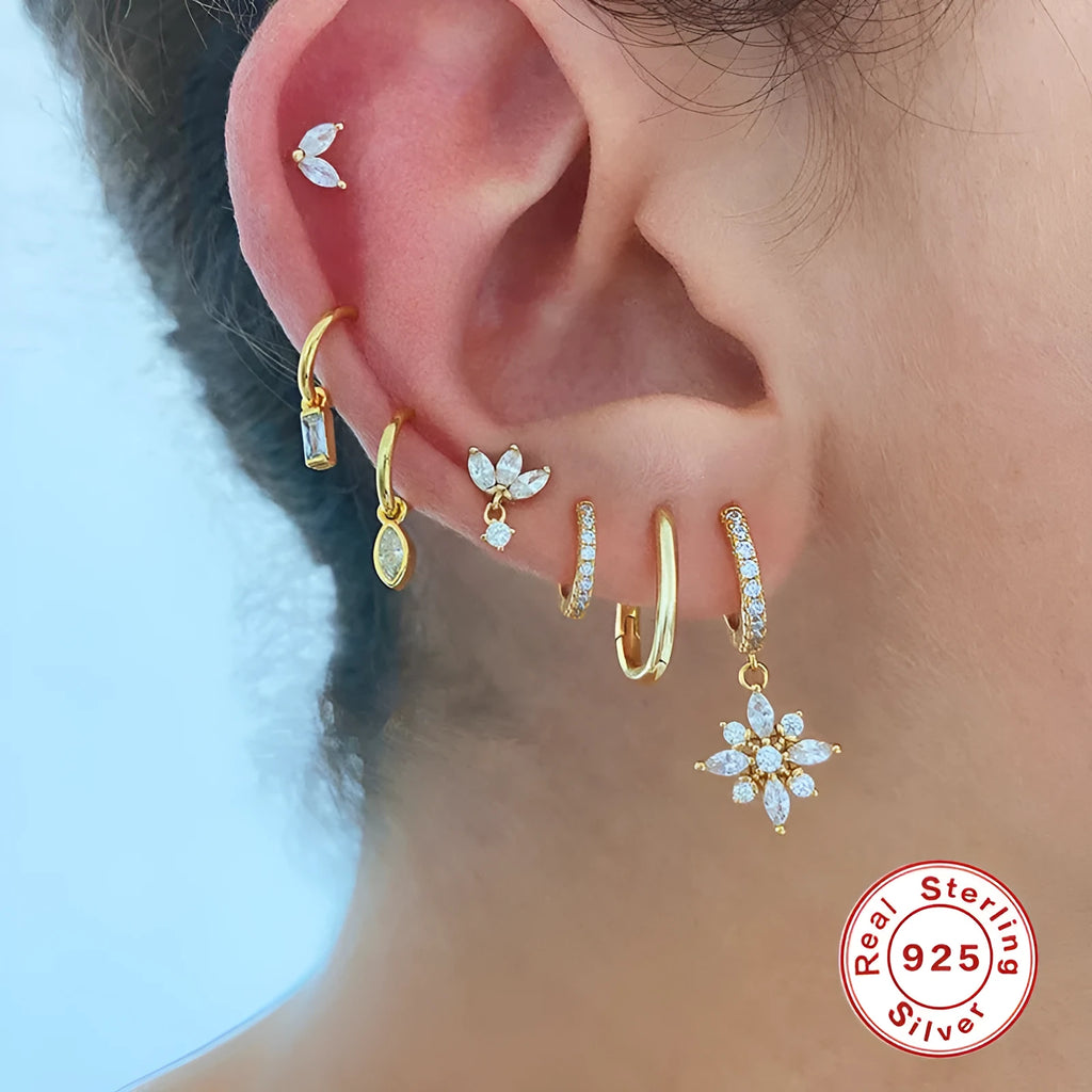Sterling silver snowflake pendant earrings showing geometric design with gold-colour finish options