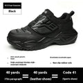 Black steel toe anti-puncture safety work boots with felt buckle and woven fabric upper.