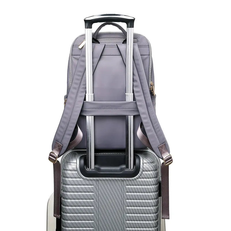 Women's Oxford cloth backpack in black or grey with large capacity and anti-theft features