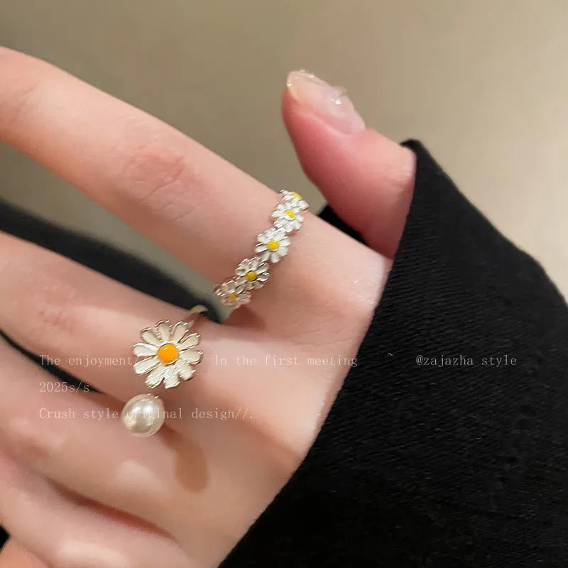 Little Daisy women's twin opening ring set in copper, one with a pearl and one plain.