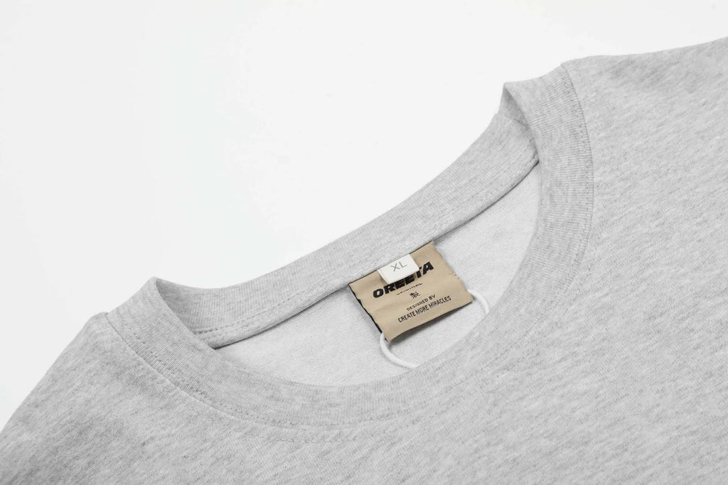 Black and Flower Grey loose fit cotton long sleeve pullover on a hanger