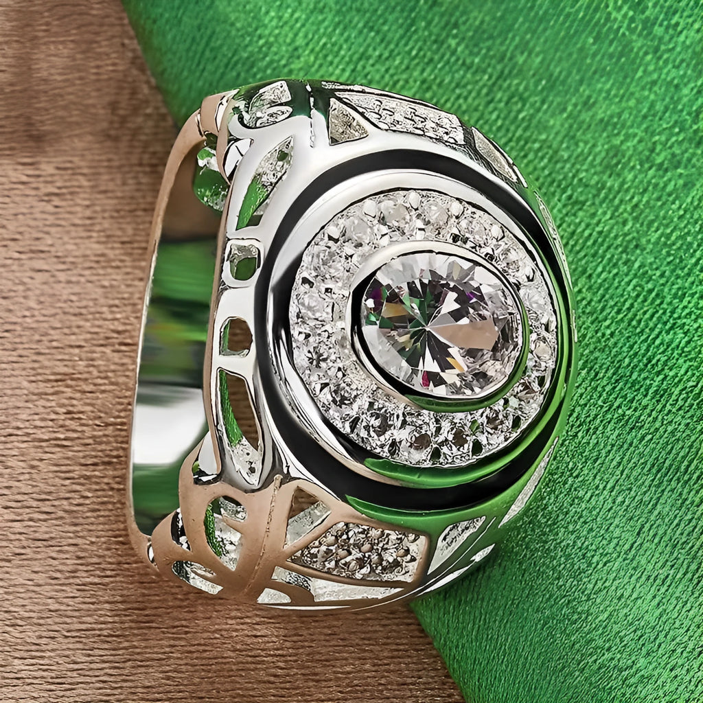 Silver round zircon ring on a flat surface, copper base with electroplated finish