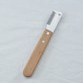 Pet stripping comb grooming tool with a wood handle and metal blade for dogs and cats.