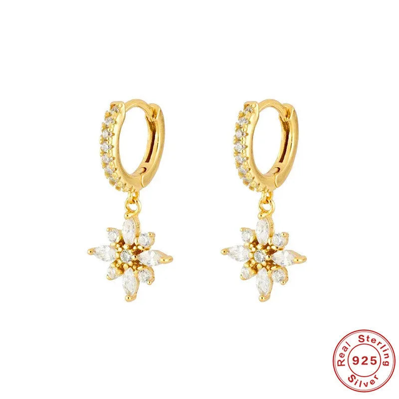 Sterling silver snowflake pendant earrings showing geometric design with gold-colour finish options