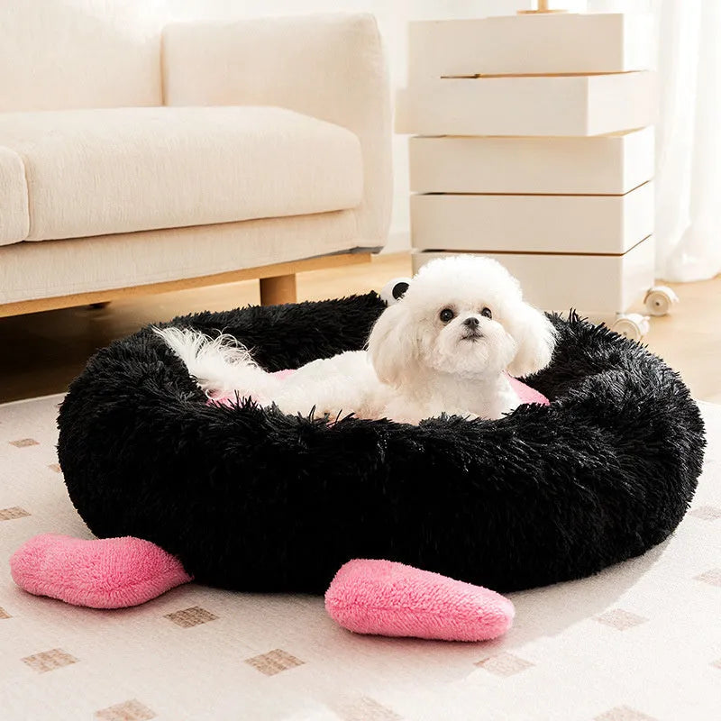Blue Elf Briquettes plush kennel pet bed with raised bolster edge for dogs or cats, shown in a home setting.