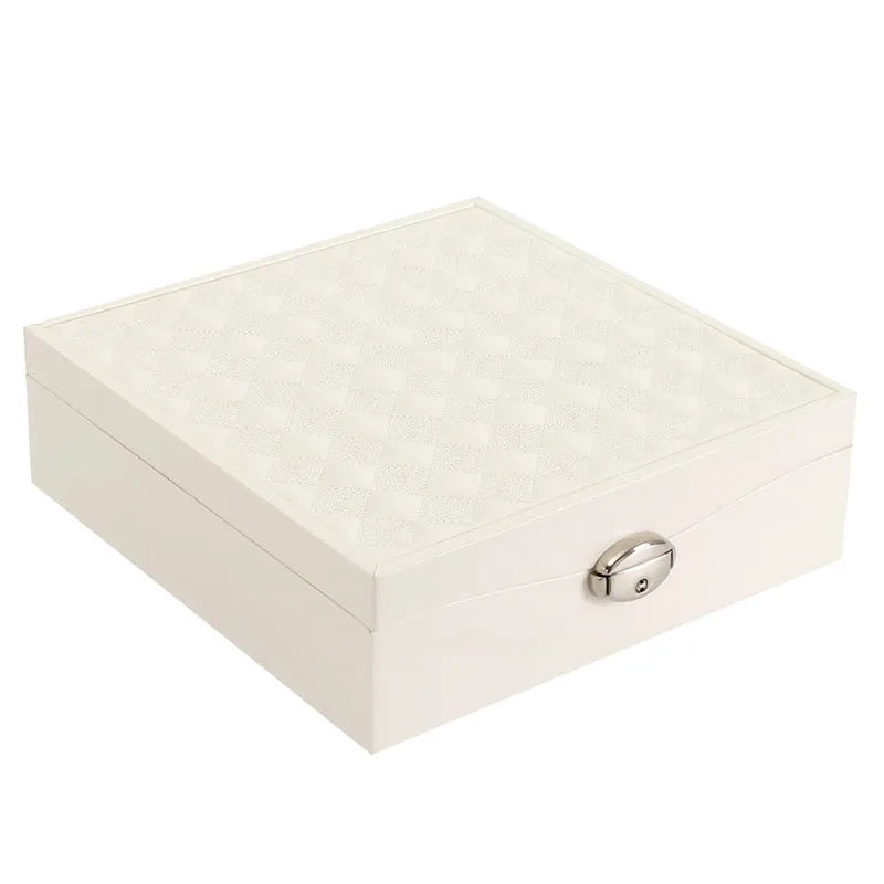 Red or white PU leather jewelry storage box with multiple compartments for necklaces and rings.