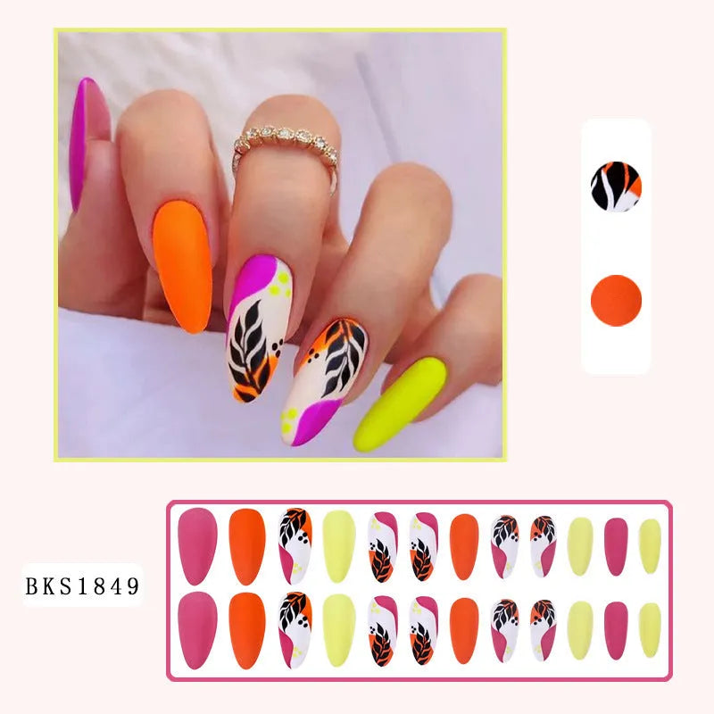 Wear Armour medium almond shaped frosted nail stickers showing four designs: French leaves, leopard print, macarons, and colour plating.