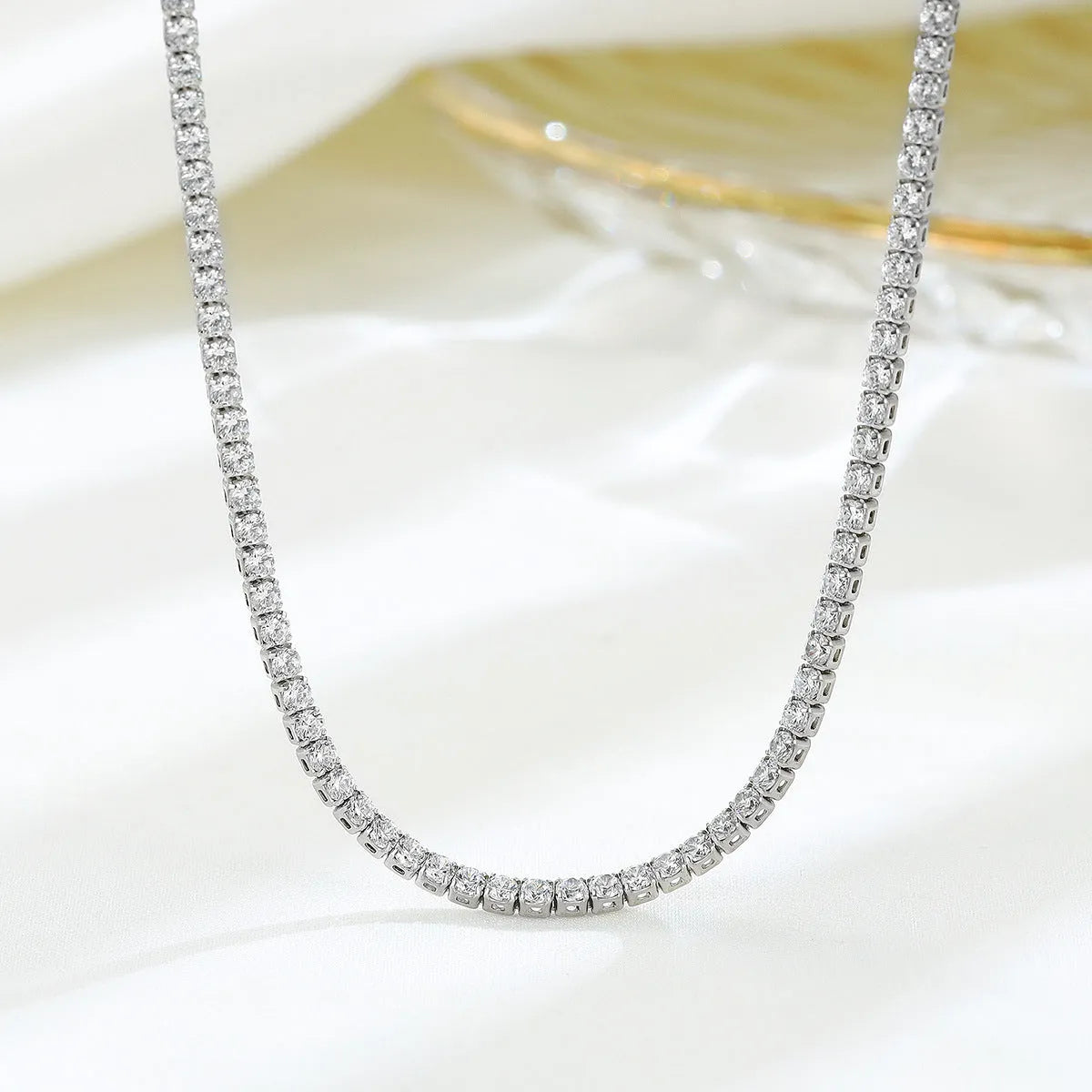 Women's sterling silver necklace with diamond-cut round pendant on fine chain