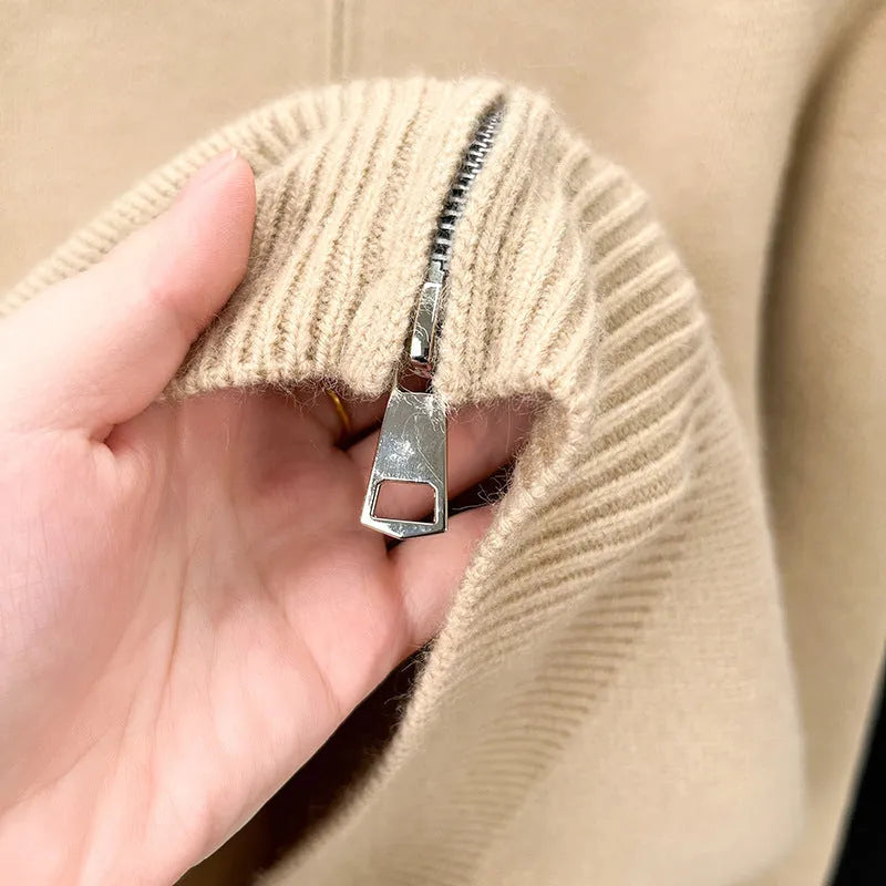 Men's black knitted cardigan with a stand collar and full-length front zipper, shown in a loose fit.