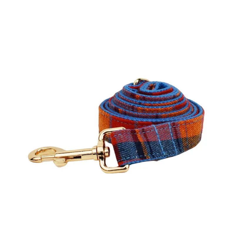 Four-piece dog collar set with matching bow tie, leash and vest in cloth material