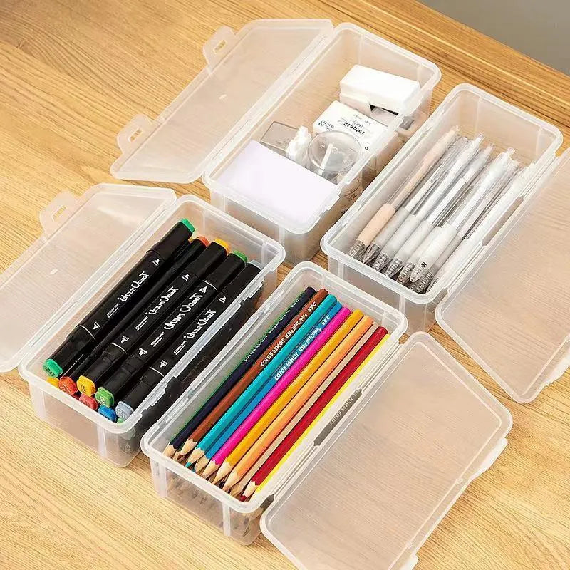 Large transparent plastic stationery storage box filled with coloured pencils and pens