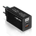 White gallium nitride 65W USB-C laptop charger with UK plug on a wooden desk