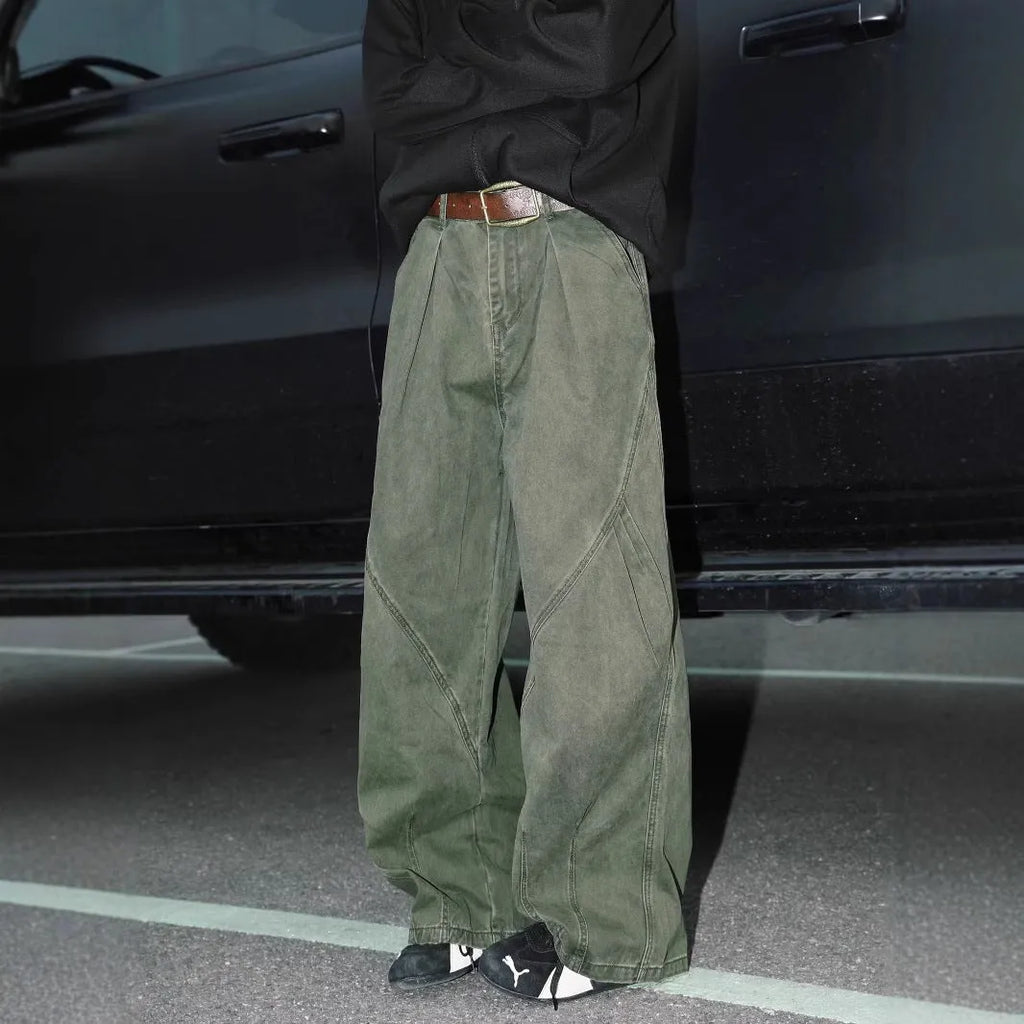 Men's pleated straight-leg loose trousers in apricot colour showing front detail and micro-elastic waistband.