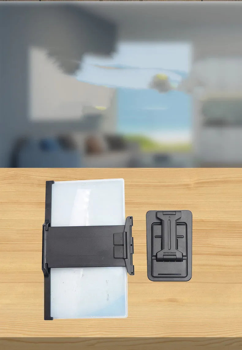 Black 12 inch mobile phone screen amplifier with detachable phone holder on desktop