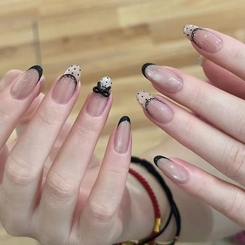 Pack of sweet pastel coloured press-on false nails for girls on a pink background.
