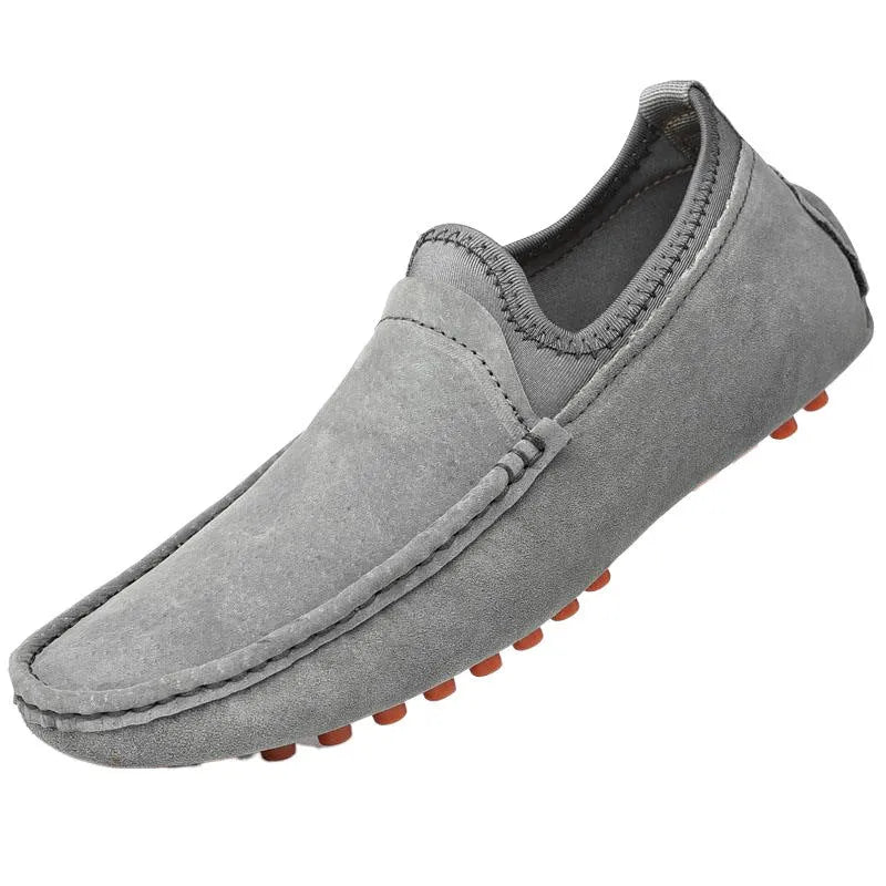 Unisex slip-on casual shoes in first layer cowhide with sewn rubber sole, shown in grey, khaki, brown and black