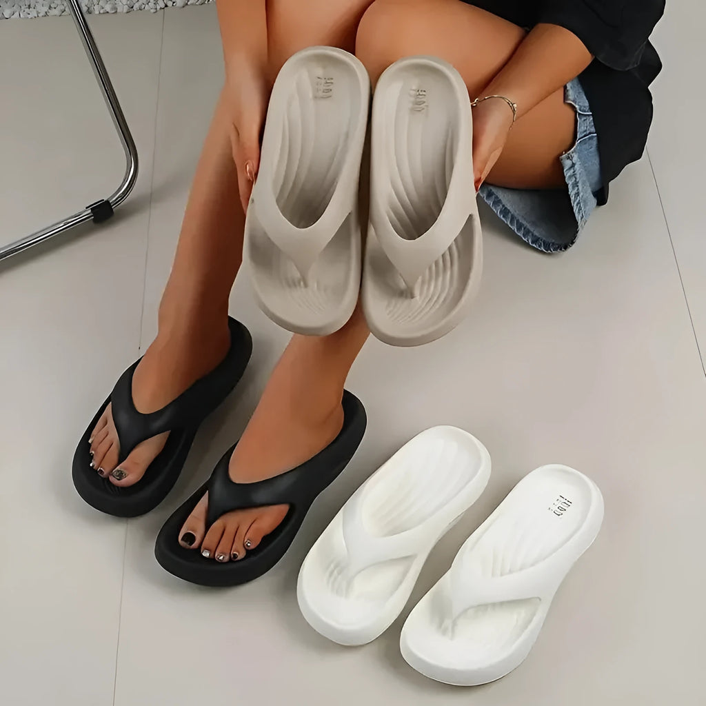 Women's thick-soled EVA flip-flops in black, white or grey with non-slip patterned soles