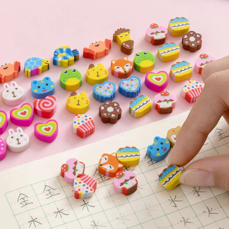 Assortment of 50 small colourful cartoon erasers showing fruit, animal, and aerospace designs.