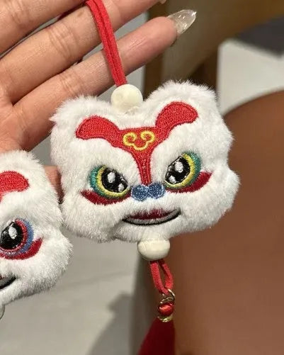 Handmade Chinese style plush lion tassel ornament keychain with star stone details in blue colour